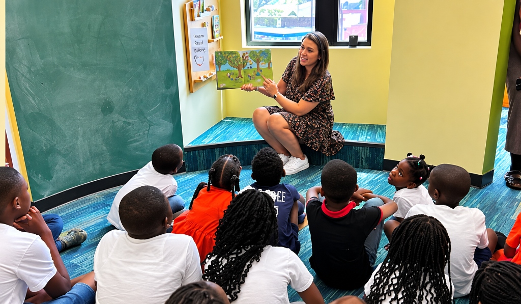 Sauti Safe Space reading circle with children and mentor